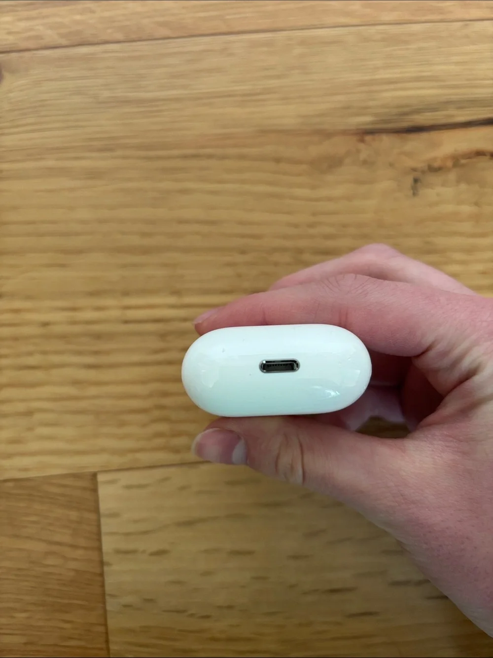 Apple AirPods (2nd gen) with charging case, charging cable, and ThredUp case